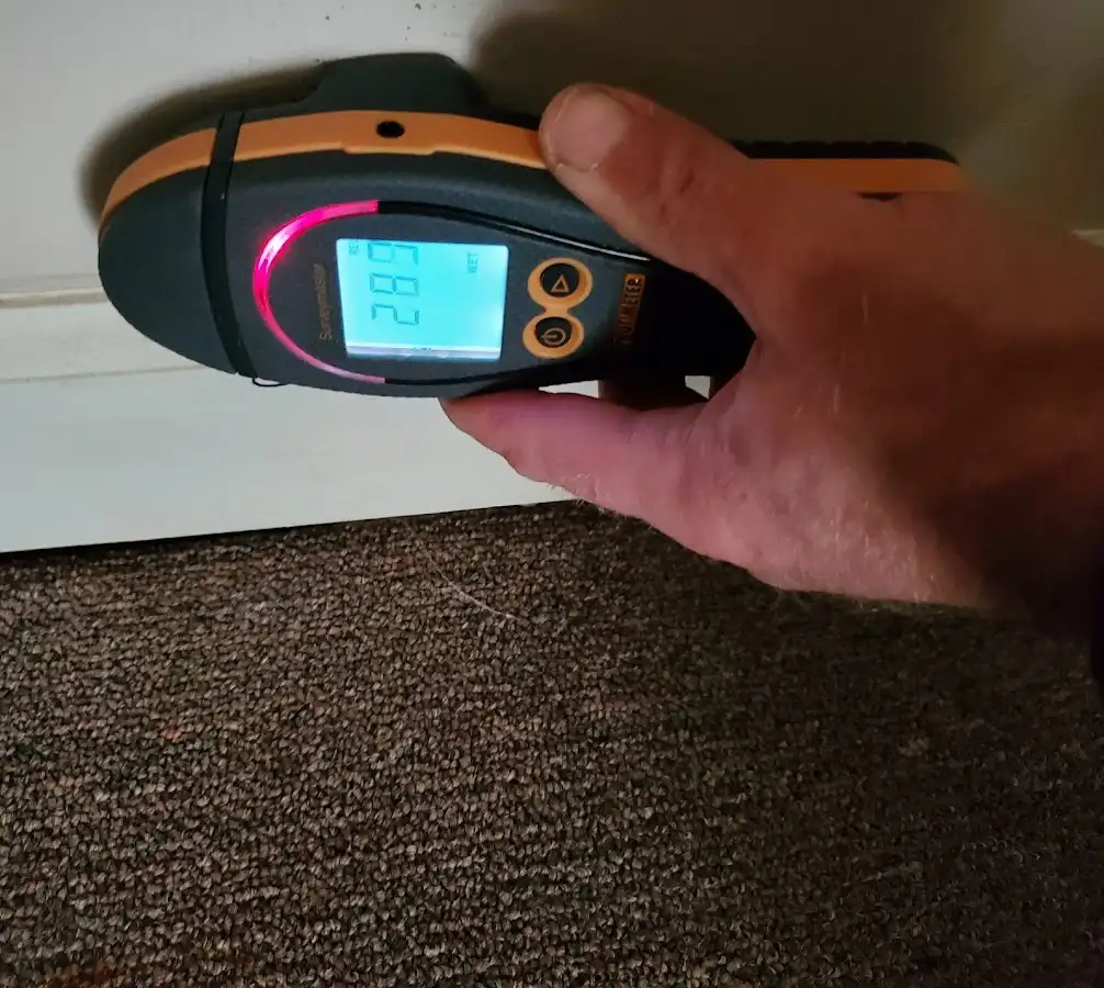 Moisture detection at baseboard during Storm Damage Restoration in Peru